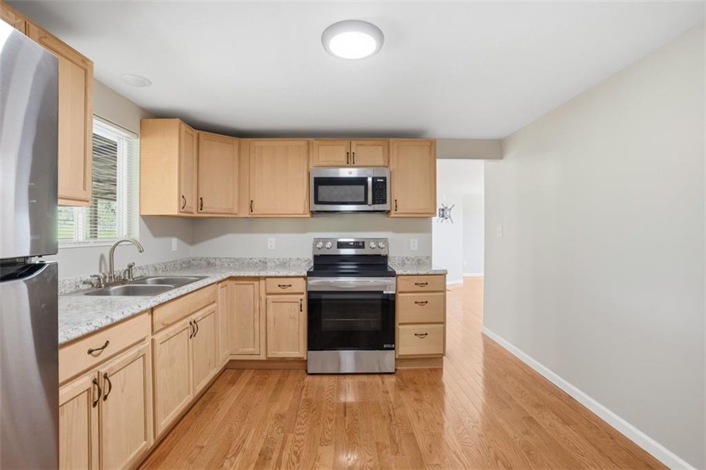 213 Fallen Timber Road Avella, PA 15312 - Photo 16 of 44 Kitchen leads to the living room and dining room. Freshly painted.