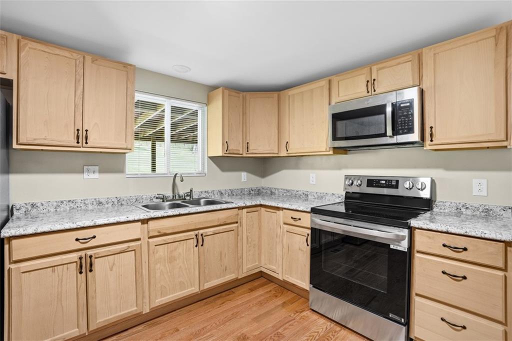 213 Fallen Timber Road Avella, PA 15312 - Photo 17 of 44 The kitchen offers ample cabinet space and beautiful views of the backyard.