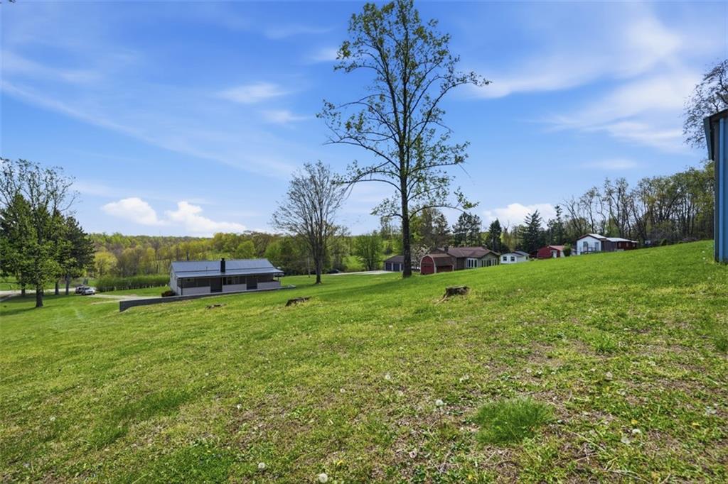 213 Fallen Timber Road Avella, PA 15312 - Photo 32 of 44 An open and inviting backyard that is perfect for enjoying sunsets, crisp evenings, and having bon fires outdoors.