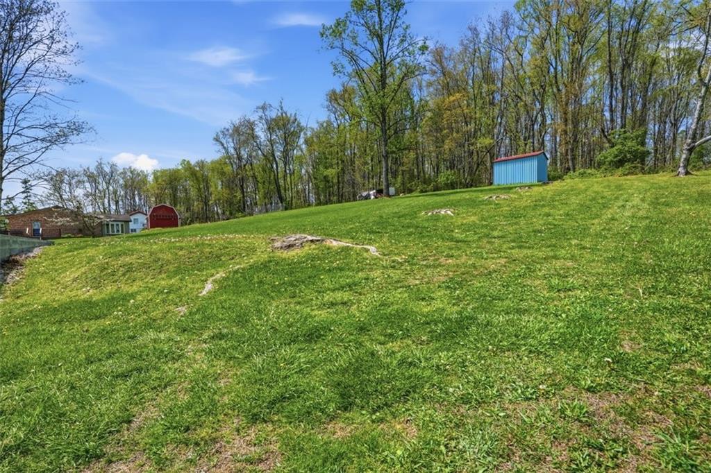 213 Fallen Timber Road Avella, PA 15312 - Photo 34 of 44 A backyard that welcomes everything from lively gatherings to quiet, restful evenings.
