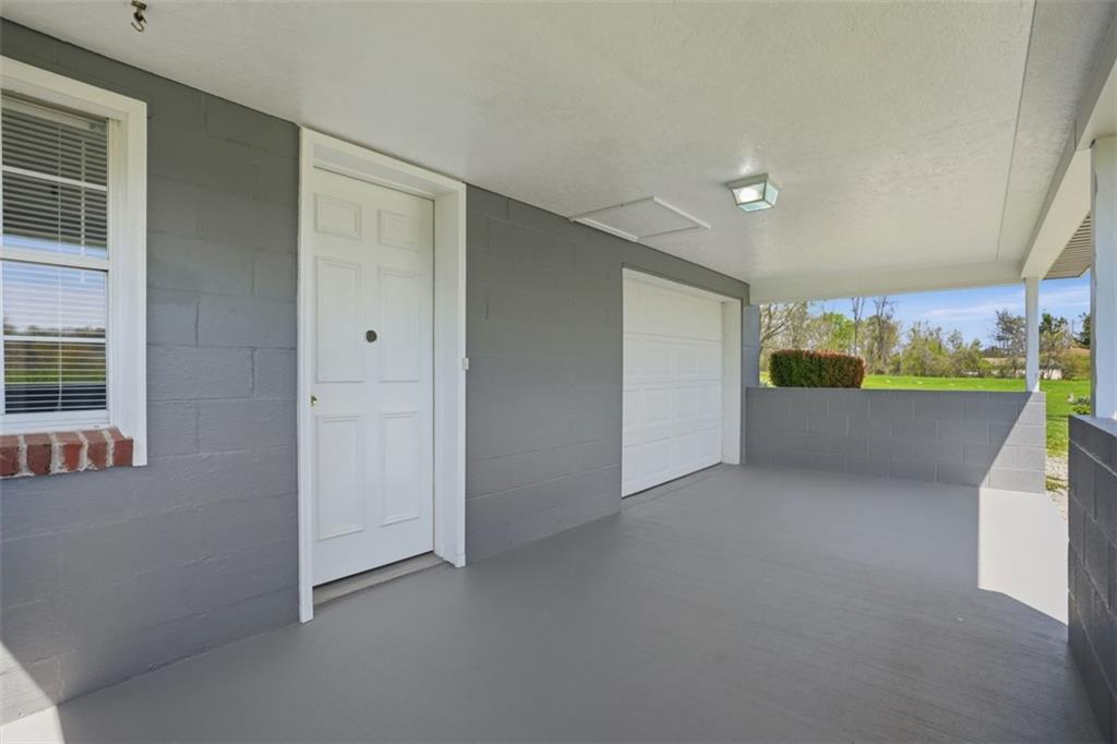 213 Fallen Timber Road Avella, PA 15312 - Photo 4 of 44 A welcoming front patio provides access to both the main entrance of the home and the attached one-car garage.