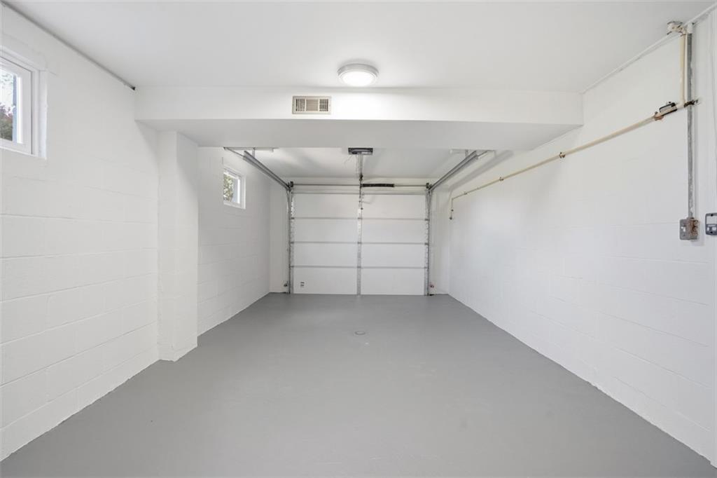 213 Fallen Timber Road Avella, PA 15312 - Photo 5 of 44 A freshly painted 1 car garage with a new garage door offers both convenient parking and extra storage or workshop potential.