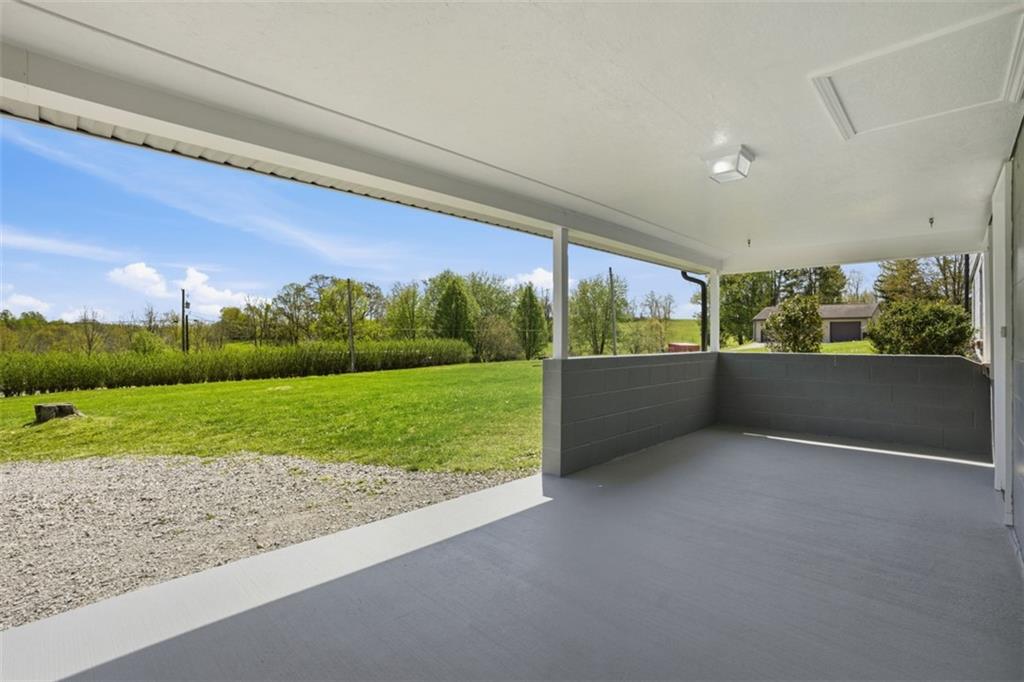 213 Fallen Timber Road Avella, PA 15312 - Photo 6 of 44 Enjoy your mornings relaxing on the front patio which has the hooks already in place to put up a porch swing and take in nature's beauty.