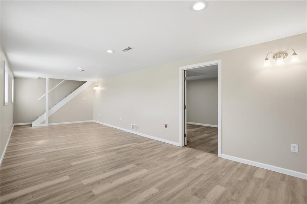 213 Fallen Timber Road Avella, PA 15312 - Photo 10 of 44 Through the doorway you will find a convenient half bathroom with laundry area down the hall and also leads you to the one car garage.