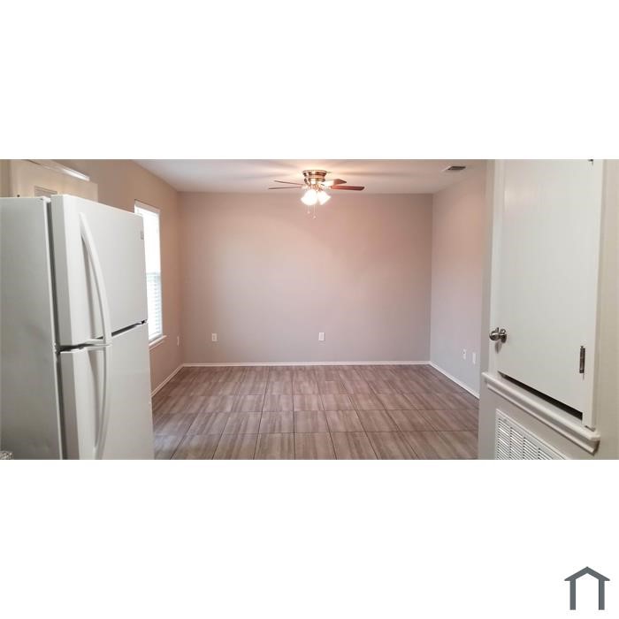 2937 Ruth Street Corpus Christi, TX 78405 - Photo 4 of 8 a open kitchen with a sink and refrigerator