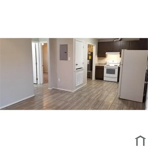 a kitchen with a sink cabinets and stainless steel appliances