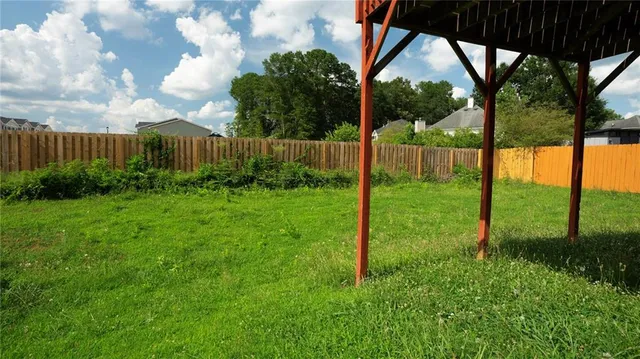 a view of a yard of the house and a yard