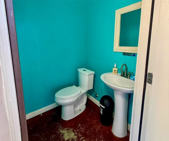 a bathroom with a toilet and a sink