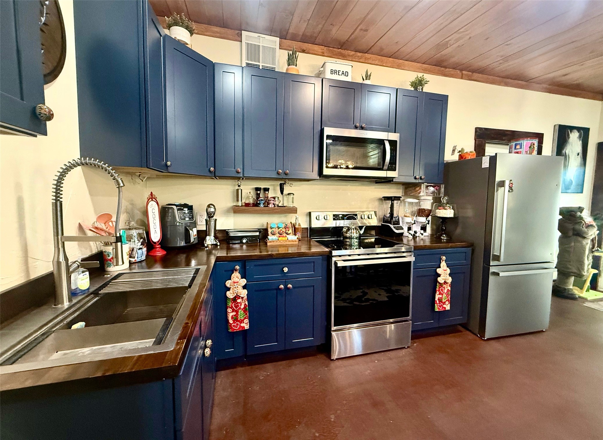 841 South S Loop Winters, TX 79567 - Photo 5 of 22 a kitchen with stainless steel appliances granite countertop a refrigerator a sink a stove and cabinets