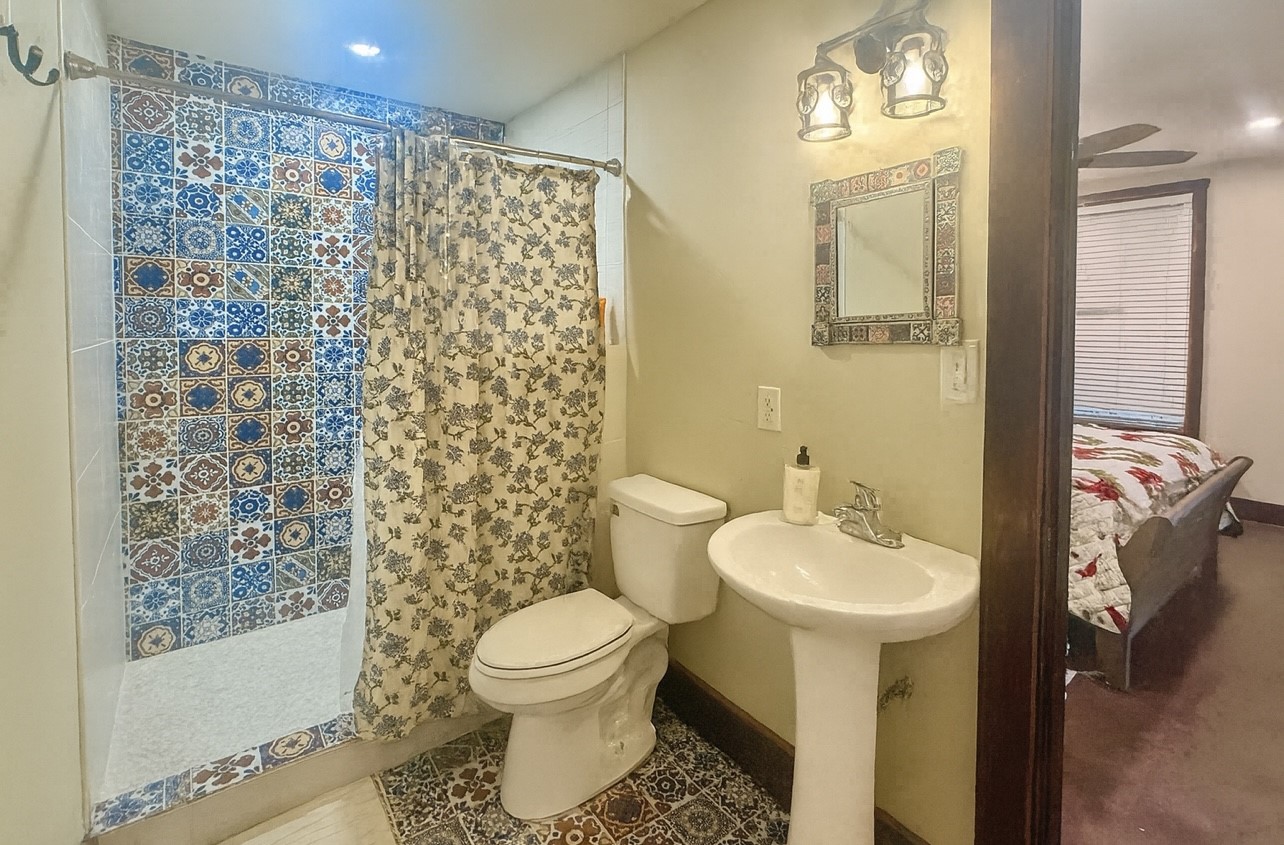 841 South S Loop Winters, TX 79567 - Photo 6 of 22 a bathroom with a sink toilet and shower