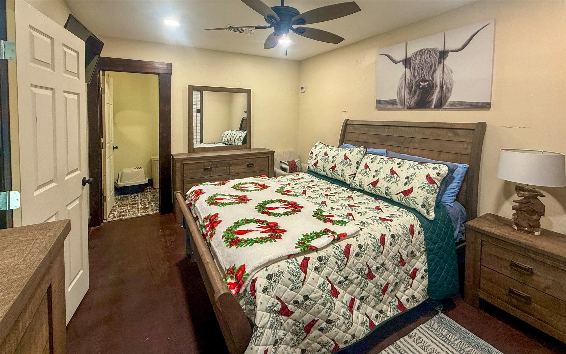 841 South S Loop Winters, TX 79567 - Photo 7 of 22 a bedroom with a bed and dresser with mirror