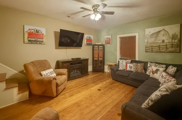 a living room with furniture and a flat screen tv
