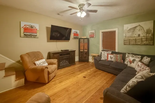 a living room with furniture and a flat screen tv
