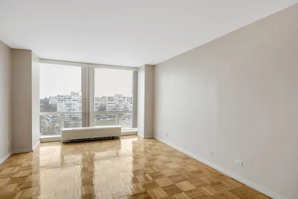 a view of an empty room with a window