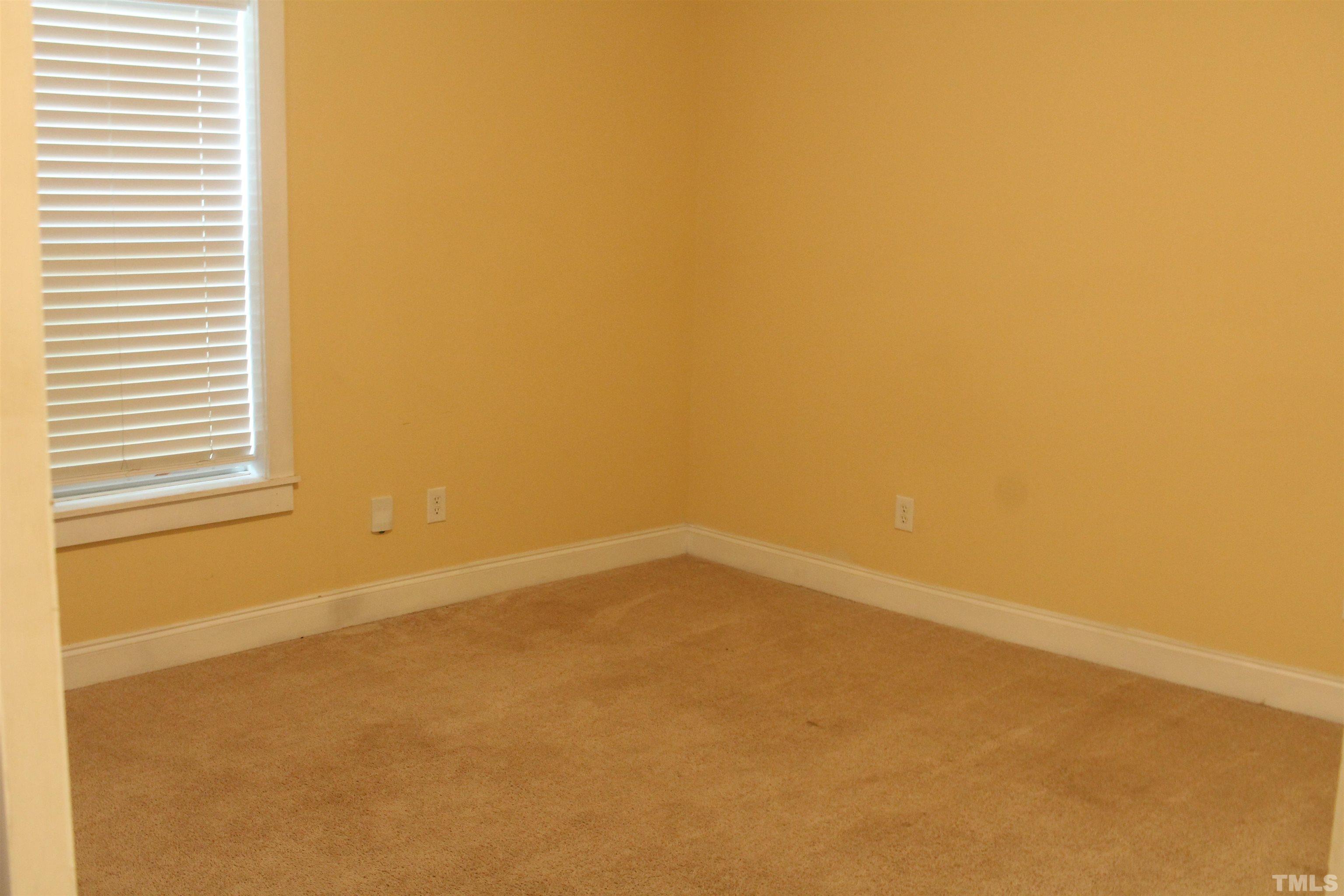 815 East Davie Street Raleigh, NC 27601 - Photo 3 of 21 a view of an empty room with a window