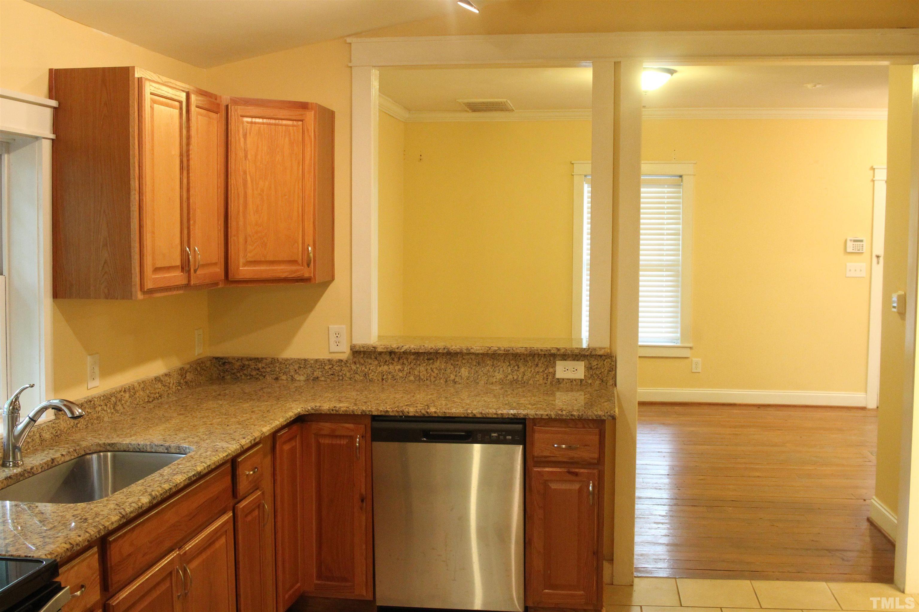 815 East Davie Street Raleigh, NC 27601 - Photo 9 of 21 a bathroom with a granite countertop sink and a mirror