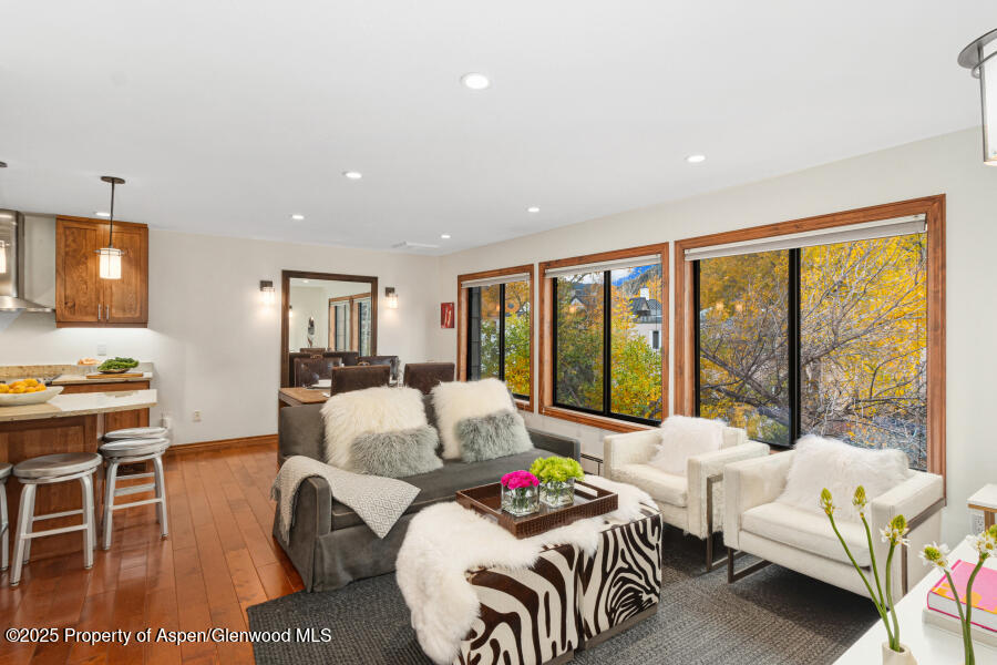 a bedroom with furniture and a large window
