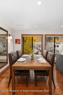 a view of a dining room with furniture window and outside view