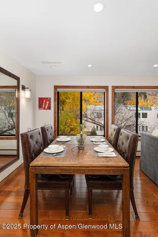 a view of a dining room with furniture window and outside view