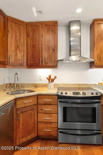 a kitchen with a stove and a sink