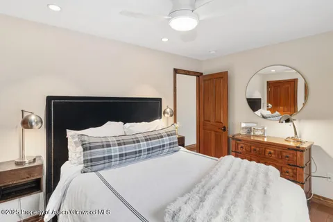 a bedroom with a bed and a dresser