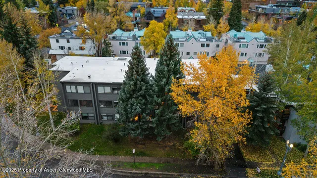 a aerial view of residential houses with outdoor space