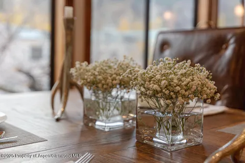 a vase of flowers sitting on a table