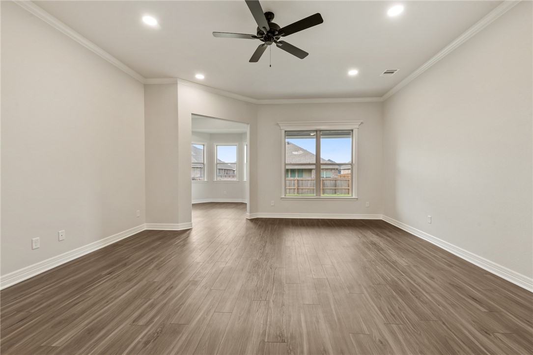 2813 Spector Drive Bryan, TX 77808 - Photo 12 of 42 wooden floor in an empty room with a window