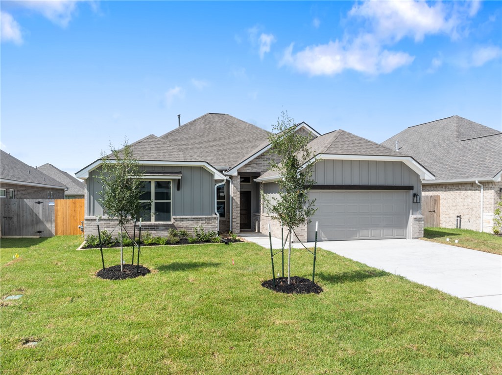 2813 Spector Drive Bryan, TX 77808 - Photo 2 of 42 a front view of a house with a yard