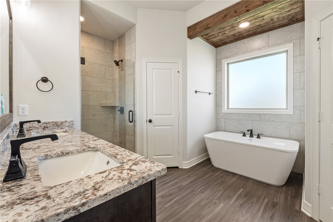 2813 Spector Drive Bryan, TX 77808 - Photo 27 of 42 a bathroom with a sink and a mirror