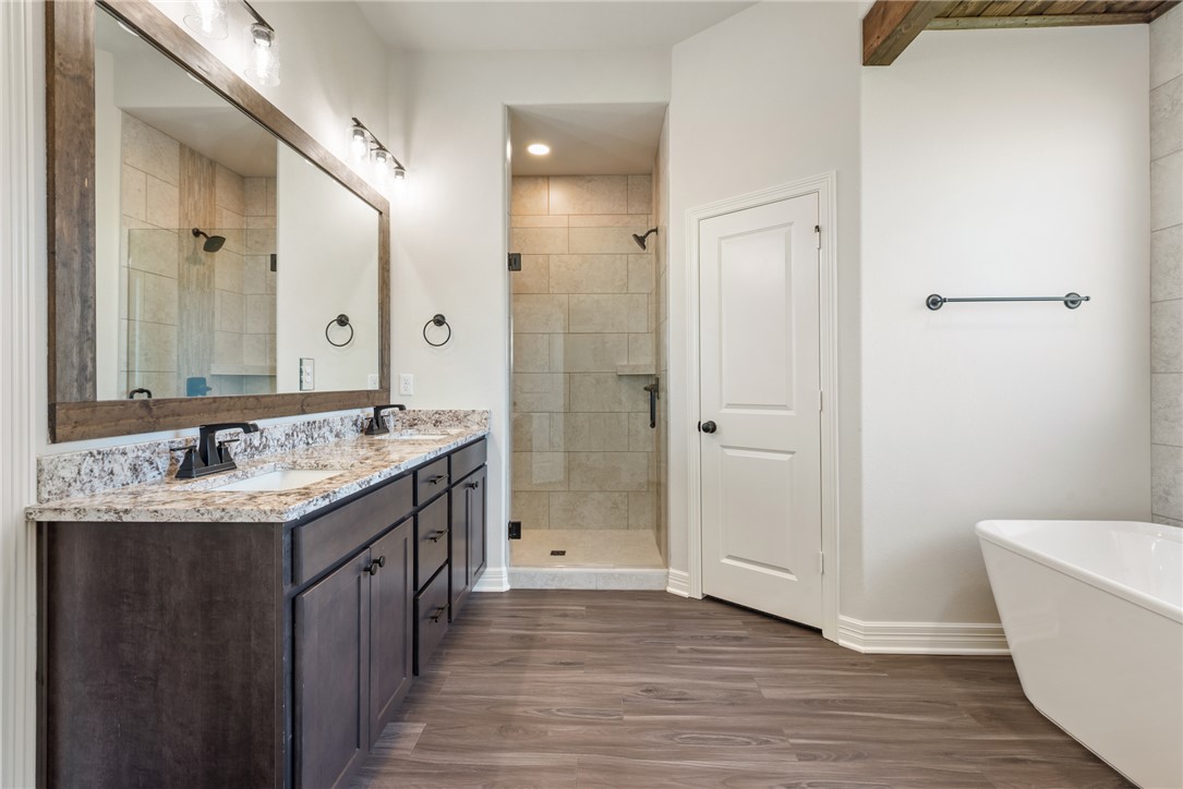 2813 Spector Drive Bryan, TX 77808 - Photo 28 of 42 a bathroom with a granite countertop sink and a mirror