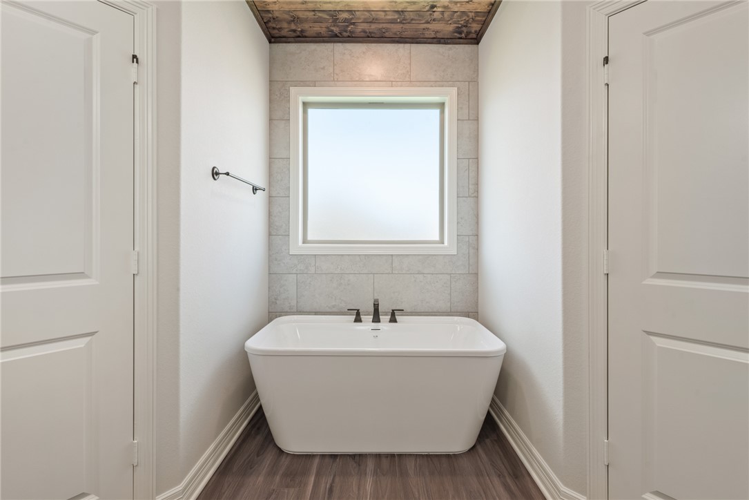 2813 Spector Drive Bryan, TX 77808 - Photo 30 of 42 a bathroom with a sink and a mirror