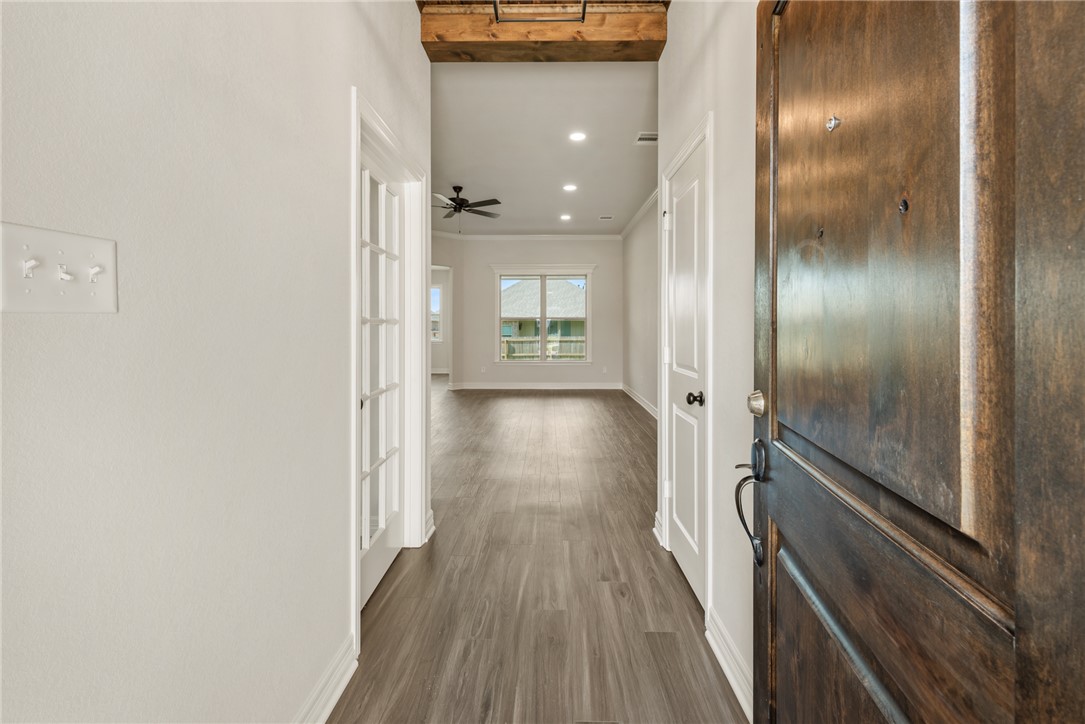 2813 Spector Drive Bryan, TX 77808 - Photo 7 of 42 a view of hallway with wooden floor