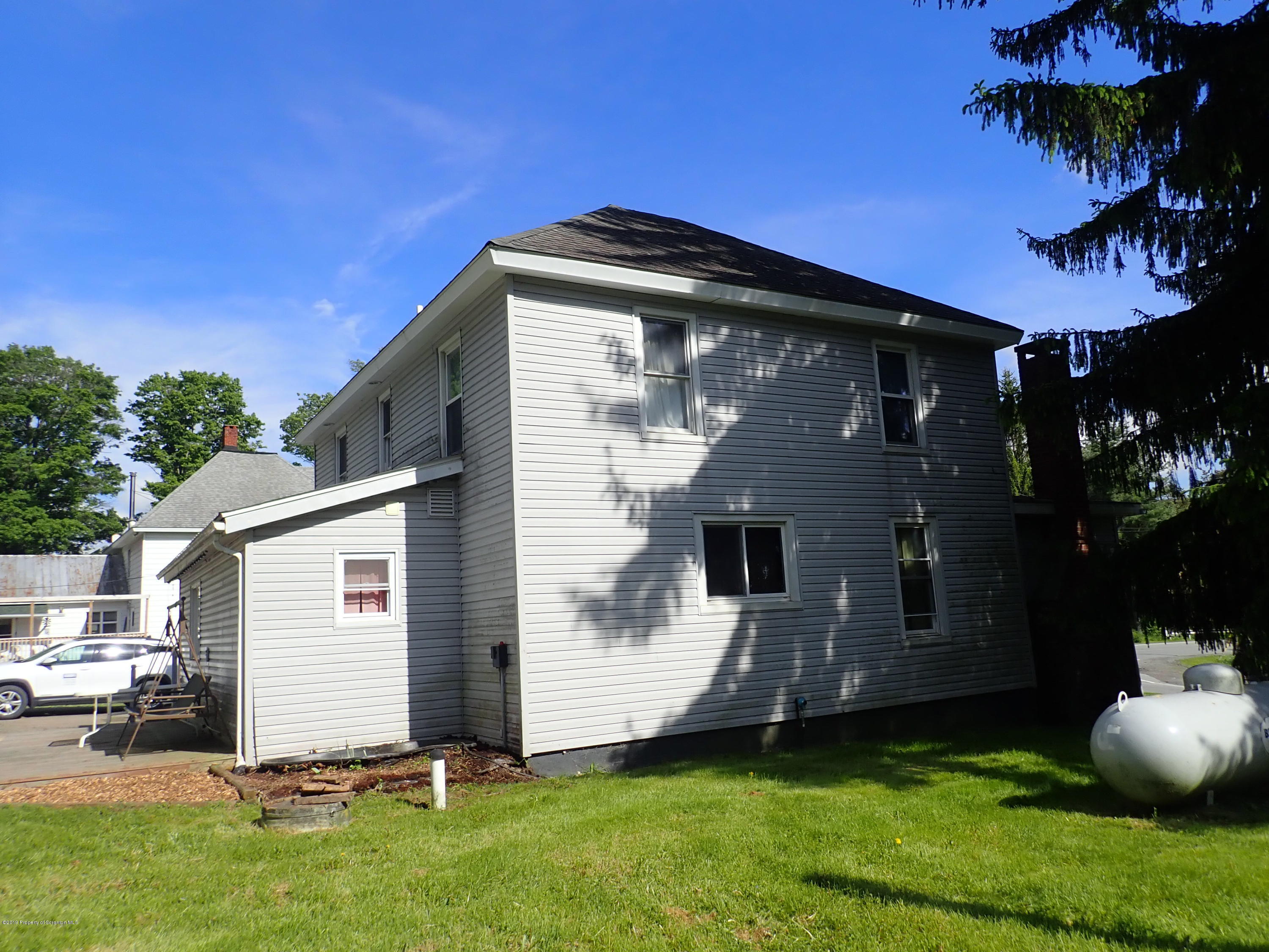 1936 Ridge Road, Unit SOUTH Montrose, PA 18801 - Photo 11 of 34 a front view of house with yard