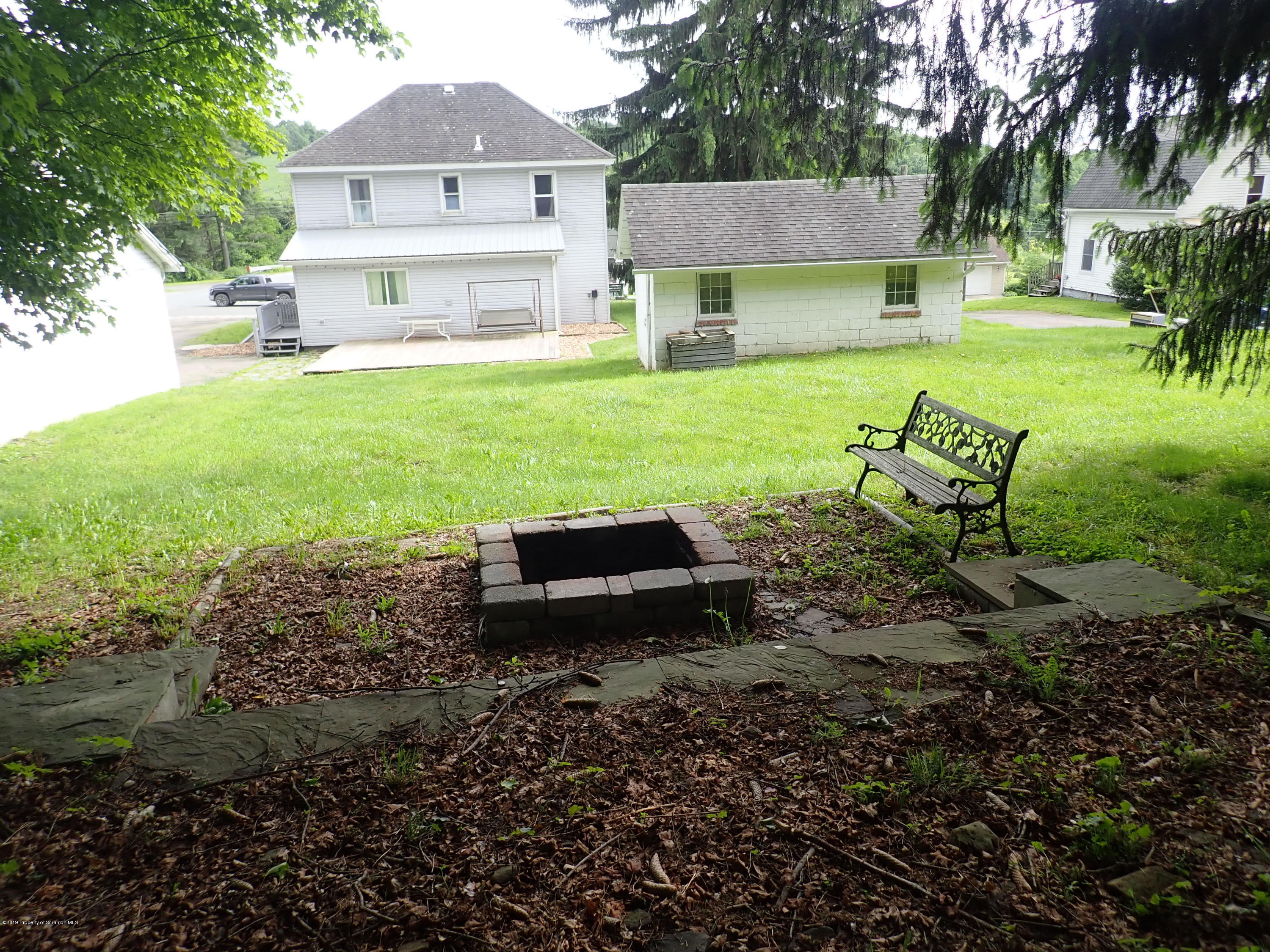 1936 Ridge Road, Unit SOUTH Montrose, PA 18801 - Photo 12 of 34 a view of a house with backyard and a sitting area