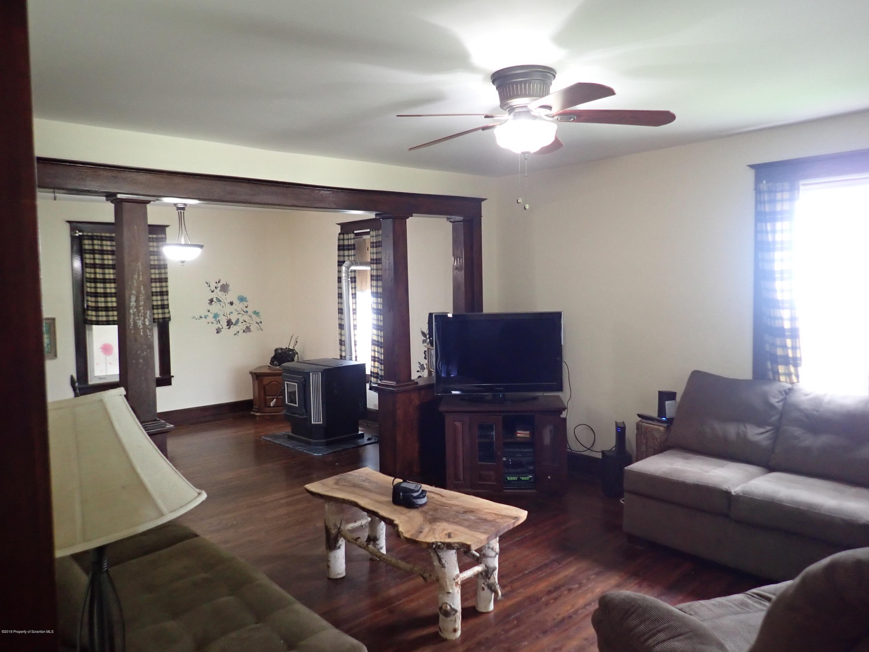 1936 Ridge Road, Unit SOUTH Montrose, PA 18801 - Photo 14 of 34 a living room with furniture and a flat screen tv