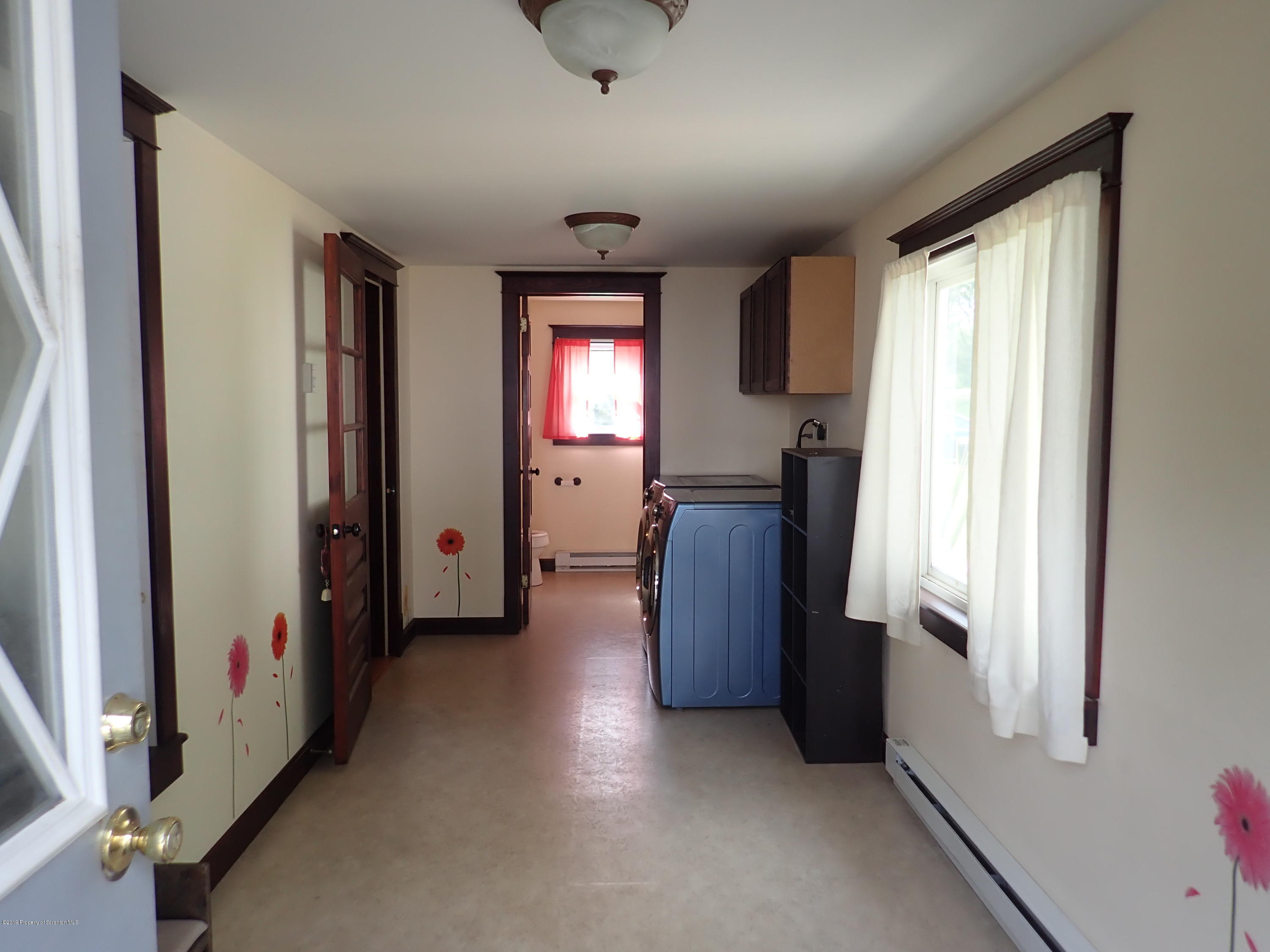 1936 Ridge Road, Unit SOUTH Montrose, PA 18801 - Photo 18 of 34 a view of a hallway with furniture and a window