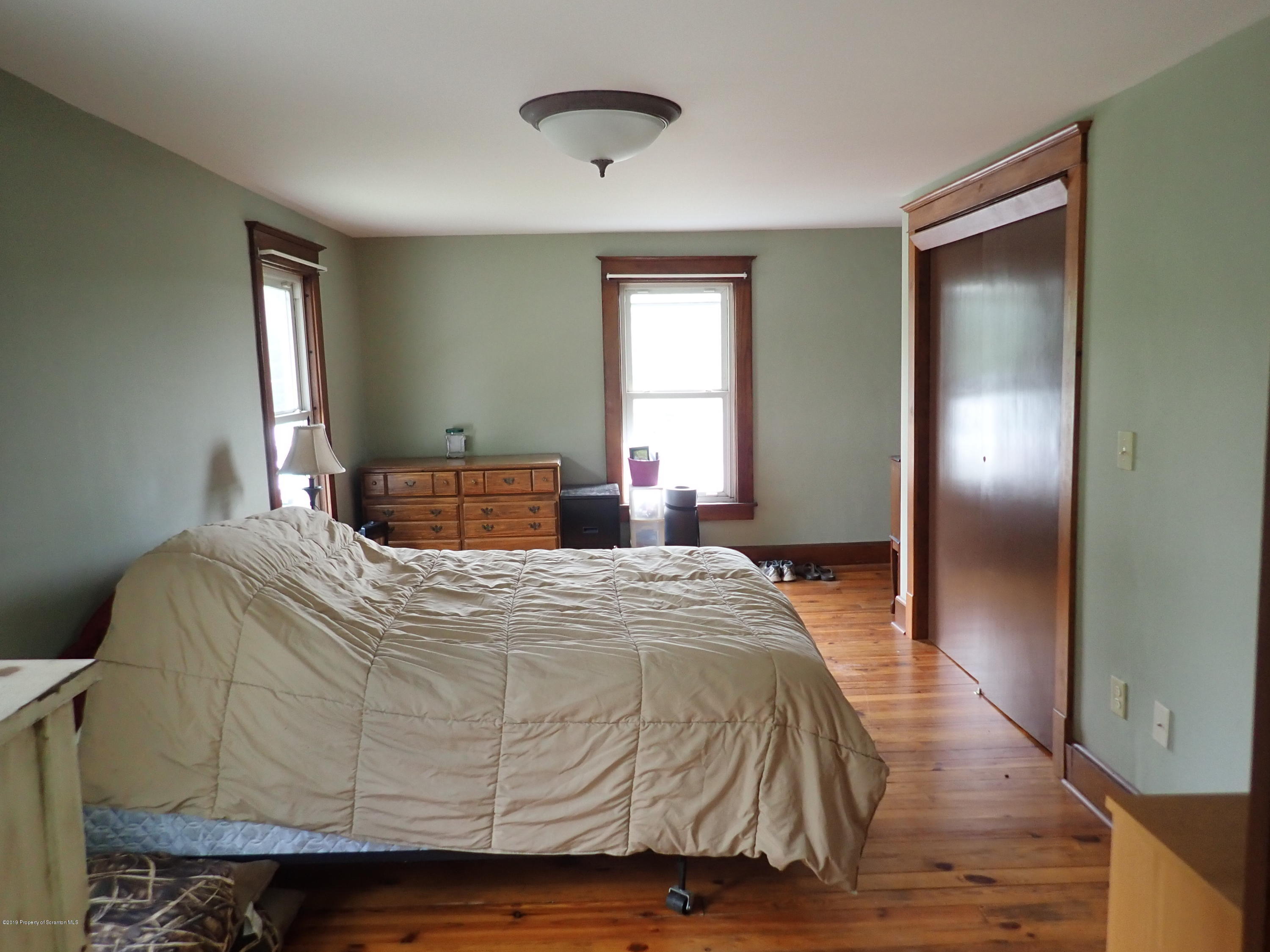 1936 Ridge Road, Unit SOUTH Montrose, PA 18801 - Photo 20 of 34 a bedroom with a bed and window