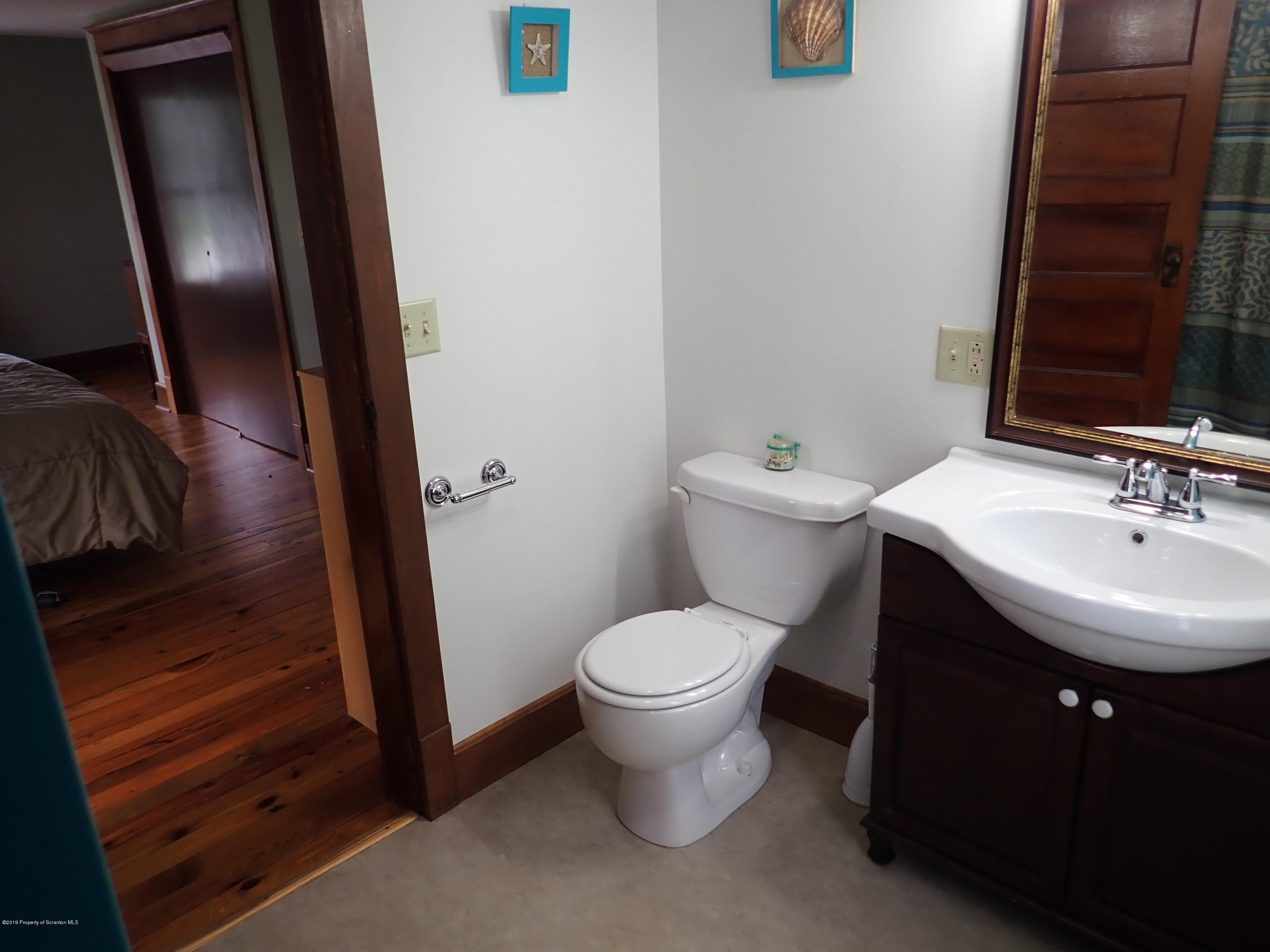 1936 Ridge Road, Unit SOUTH Montrose, PA 18801 - Photo 22 of 34 a bathroom with a sink toilet and shower