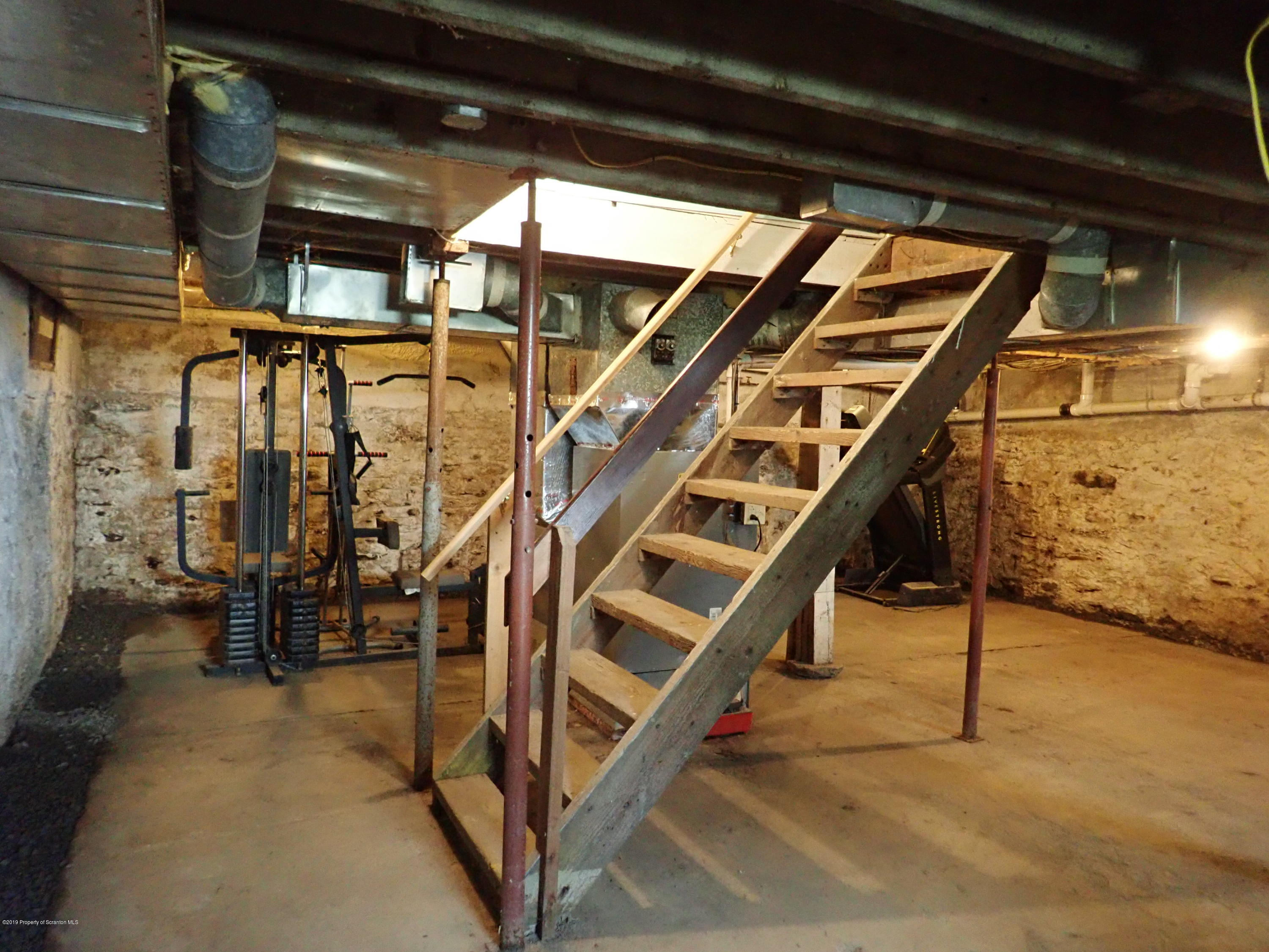 1936 Ridge Road, Unit SOUTH Montrose, PA 18801 - Photo 29 of 34 a view of an empty room with stairs
