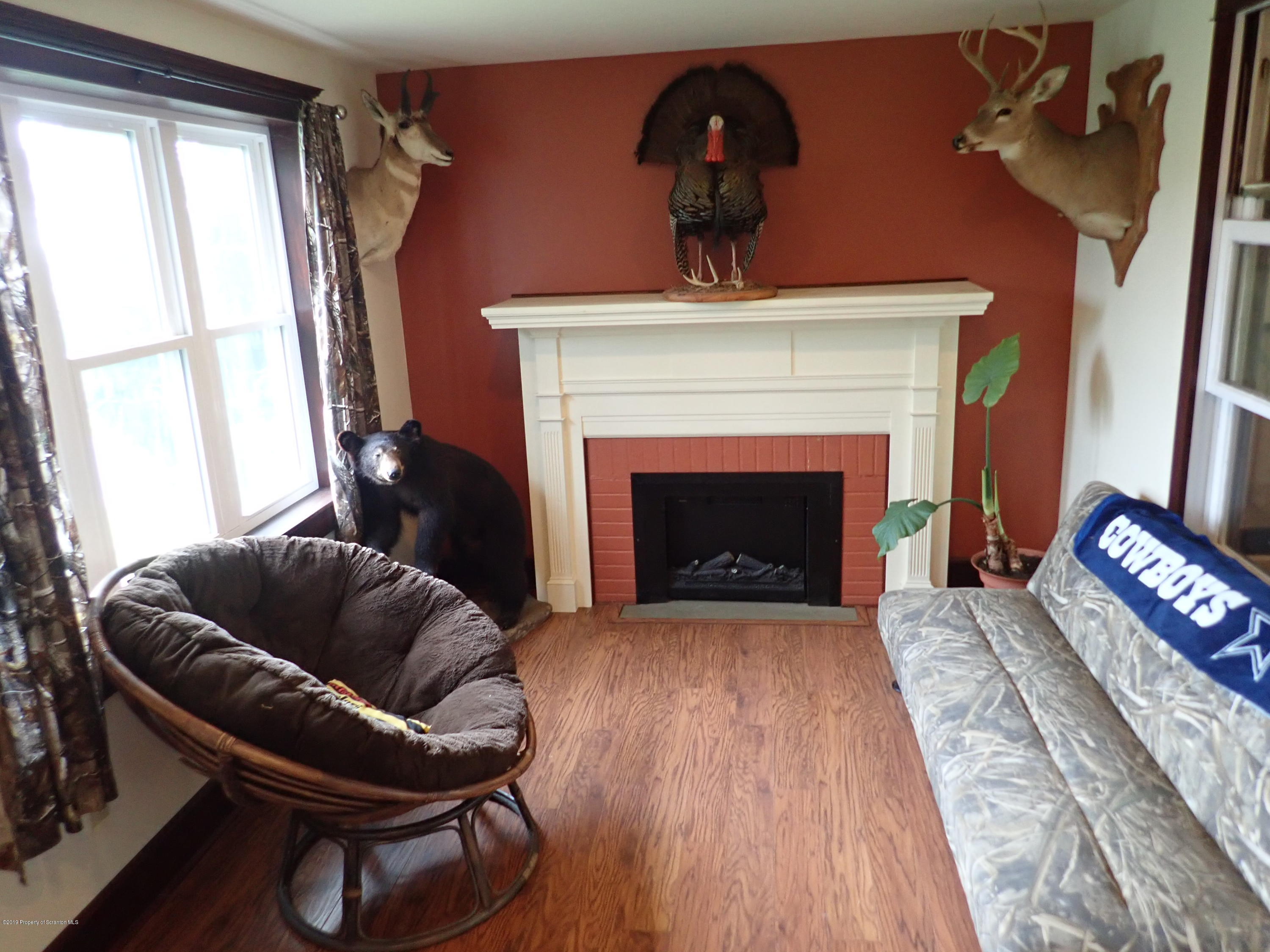 1936 Ridge Road, Unit SOUTH Montrose, PA 18801 - Photo 5 of 34 a living room with furniture and a fireplace