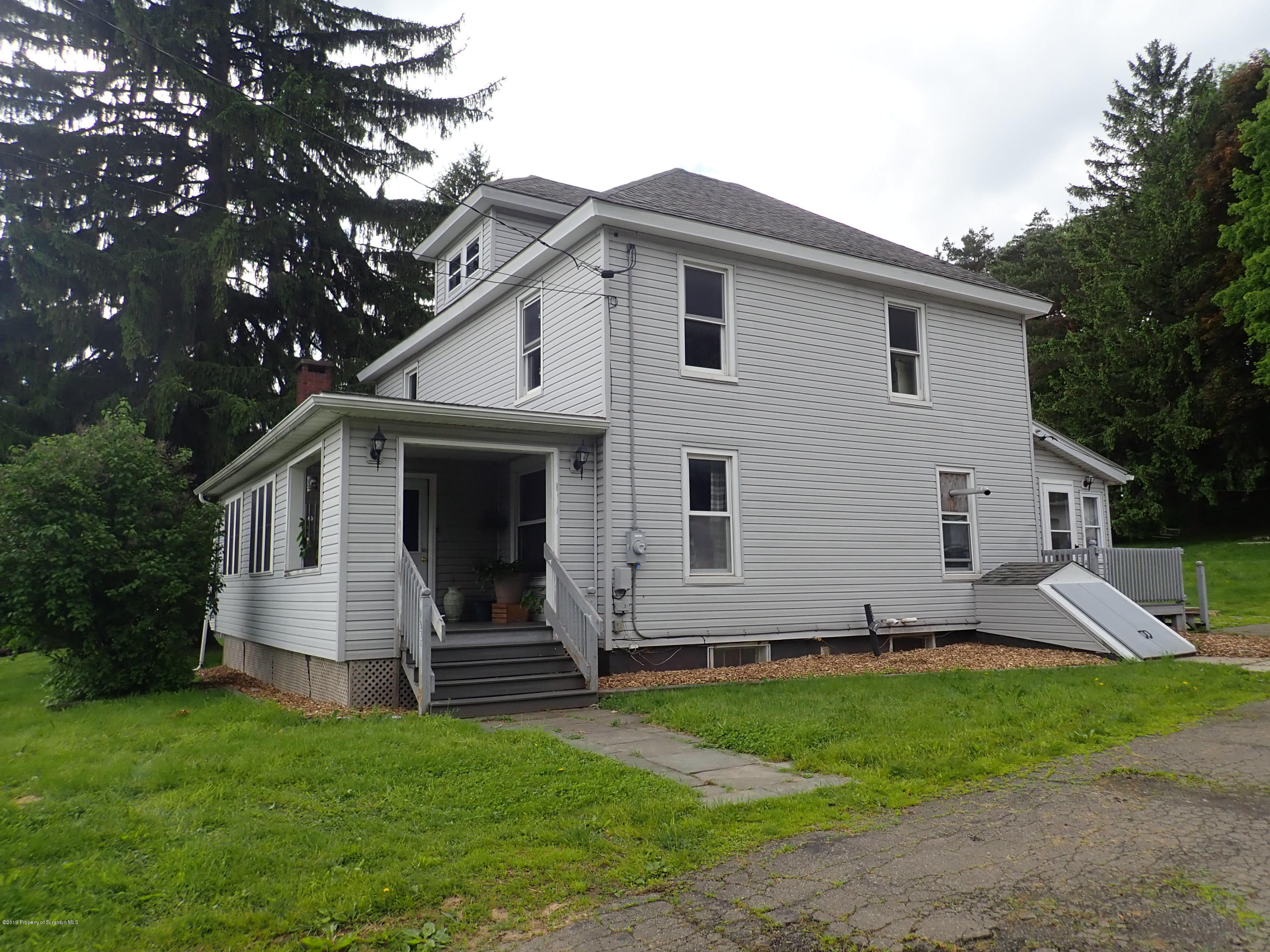 1936 Ridge Road, Unit SOUTH Montrose, PA 18801 - Photo 7 of 34 a view of a house with a yard
