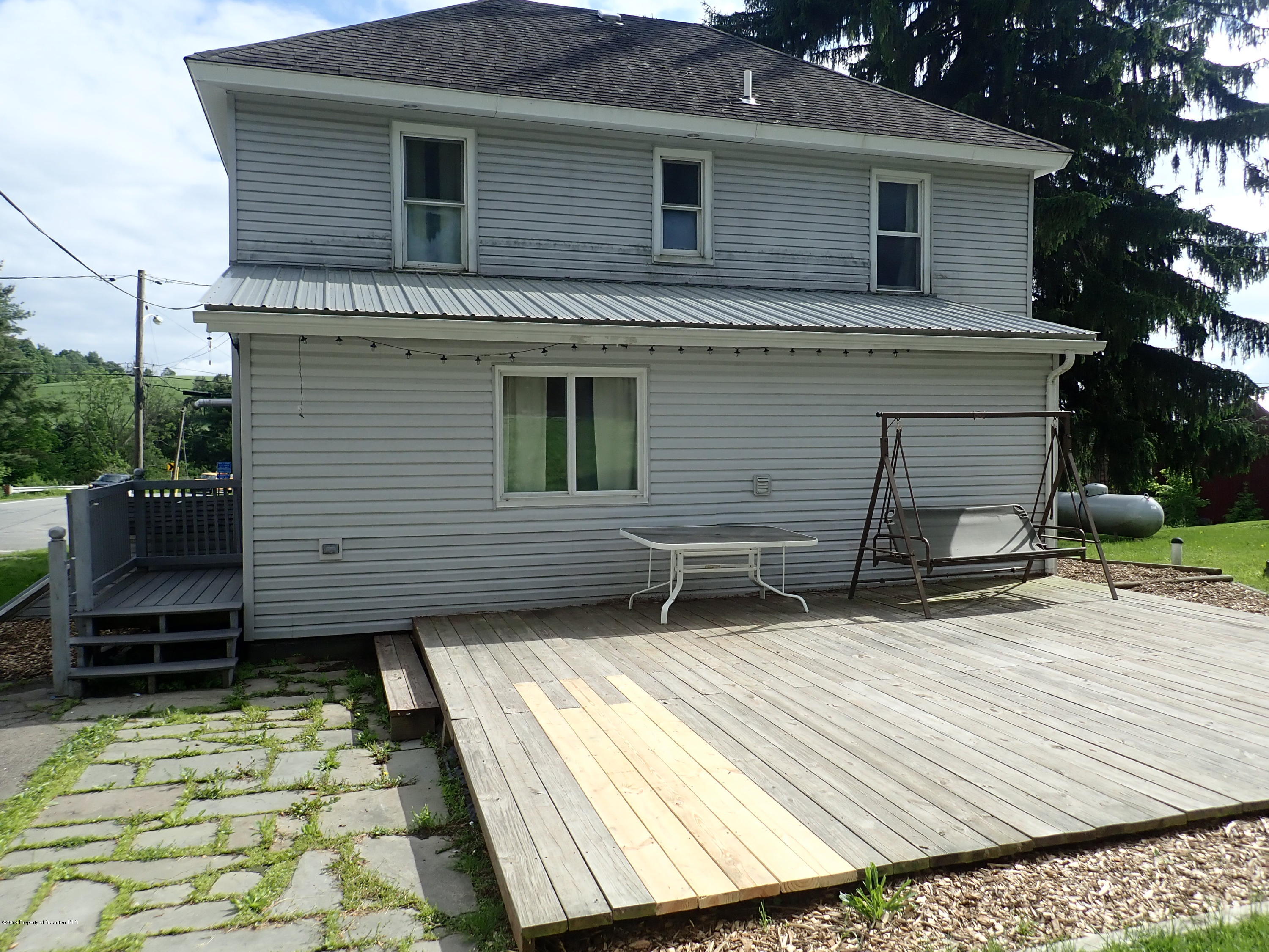 1936 Ridge Road, Unit SOUTH Montrose, PA 18801 - Photo 9 of 34 a backyard of a house with seating space