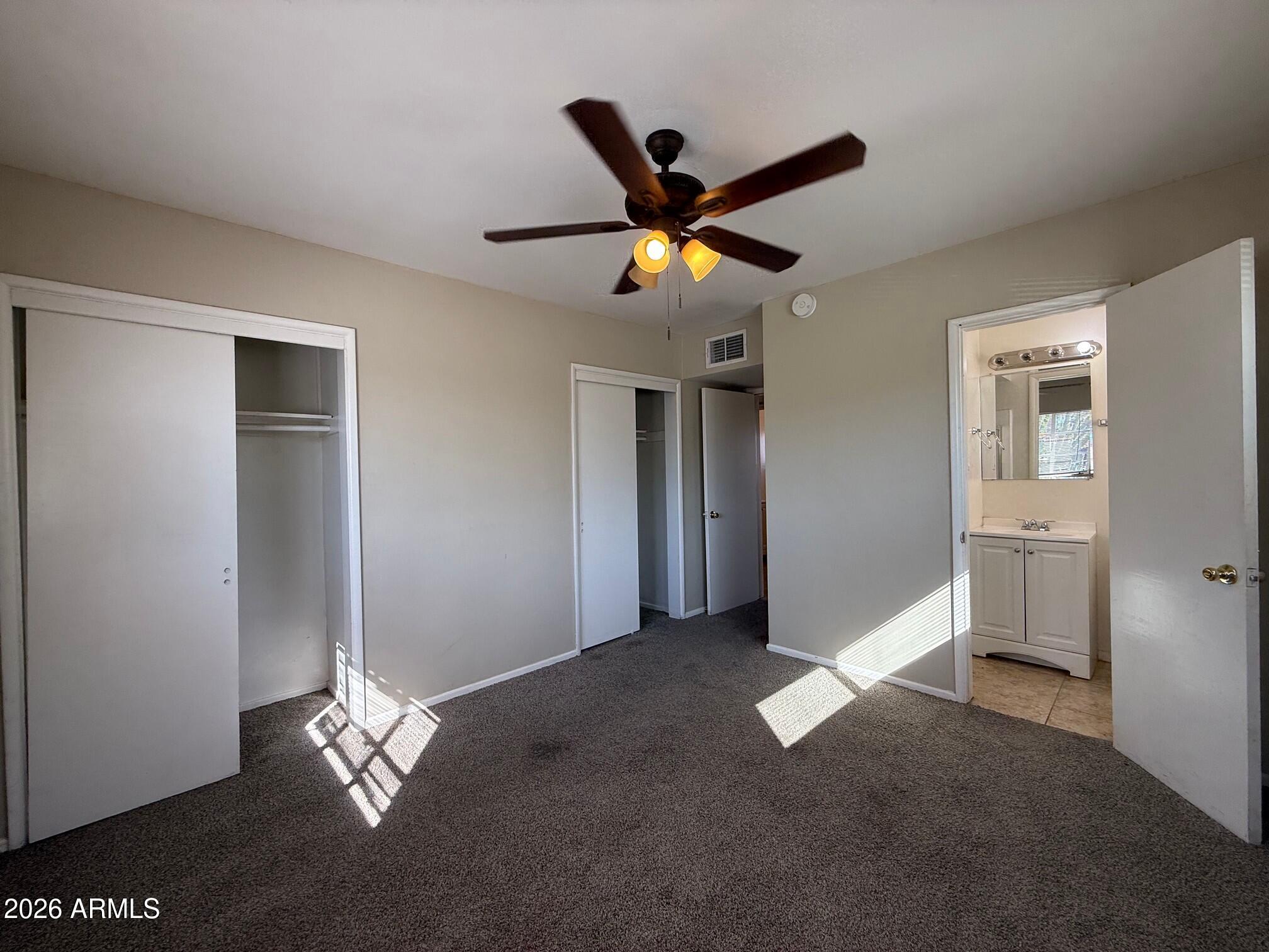 4447 East Almeria Road Phoenix, AZ 85008 - Photo 6 of 9 a view of livingroom with a ceiling fan and window
