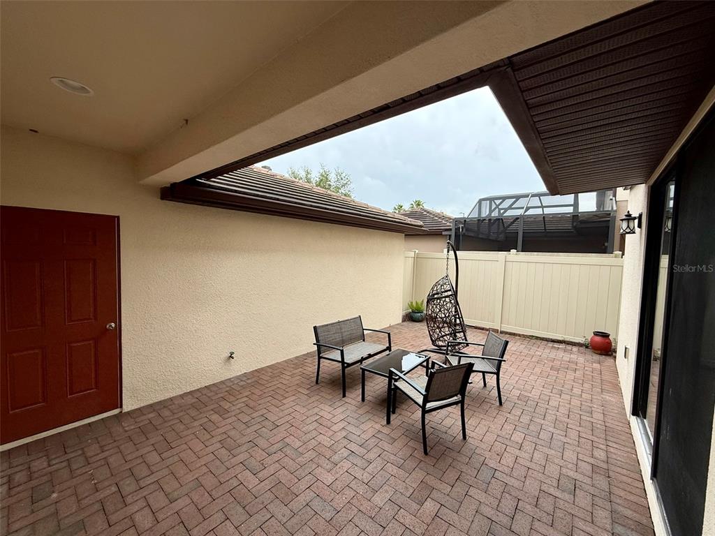 10631 Village Lake Road Windermere, FL 34786 - Photo 32 of 38 Patio between garage and home