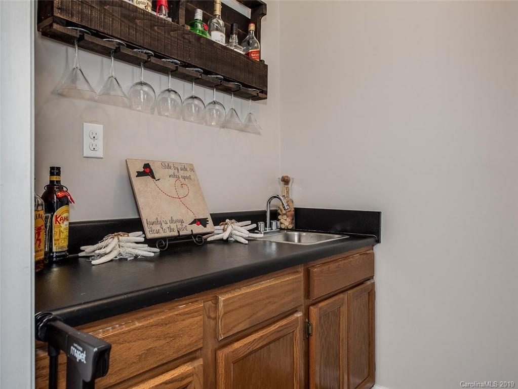 10118 Fairway Ridge Road Charlotte, NC 28277 - Photo 8 of 23 a room with a sink and cabinets