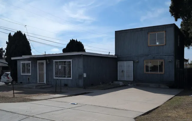 a front view of a house with yard