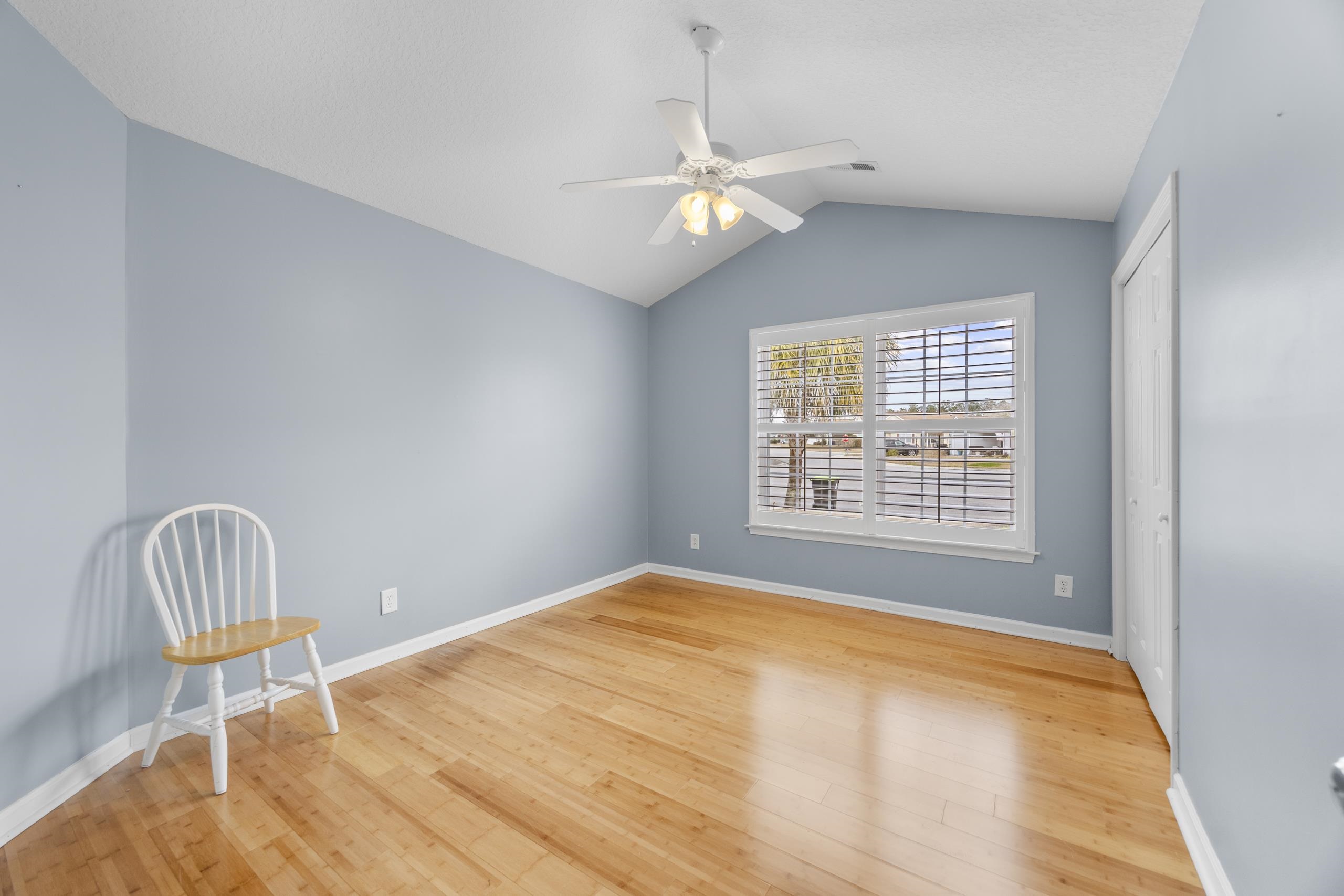 722 Downing Court Longs, SC 29568 - Photo 19 of 40 Bedroom with vaulted ceiling, light wood-style flooring, and a ceiling fan