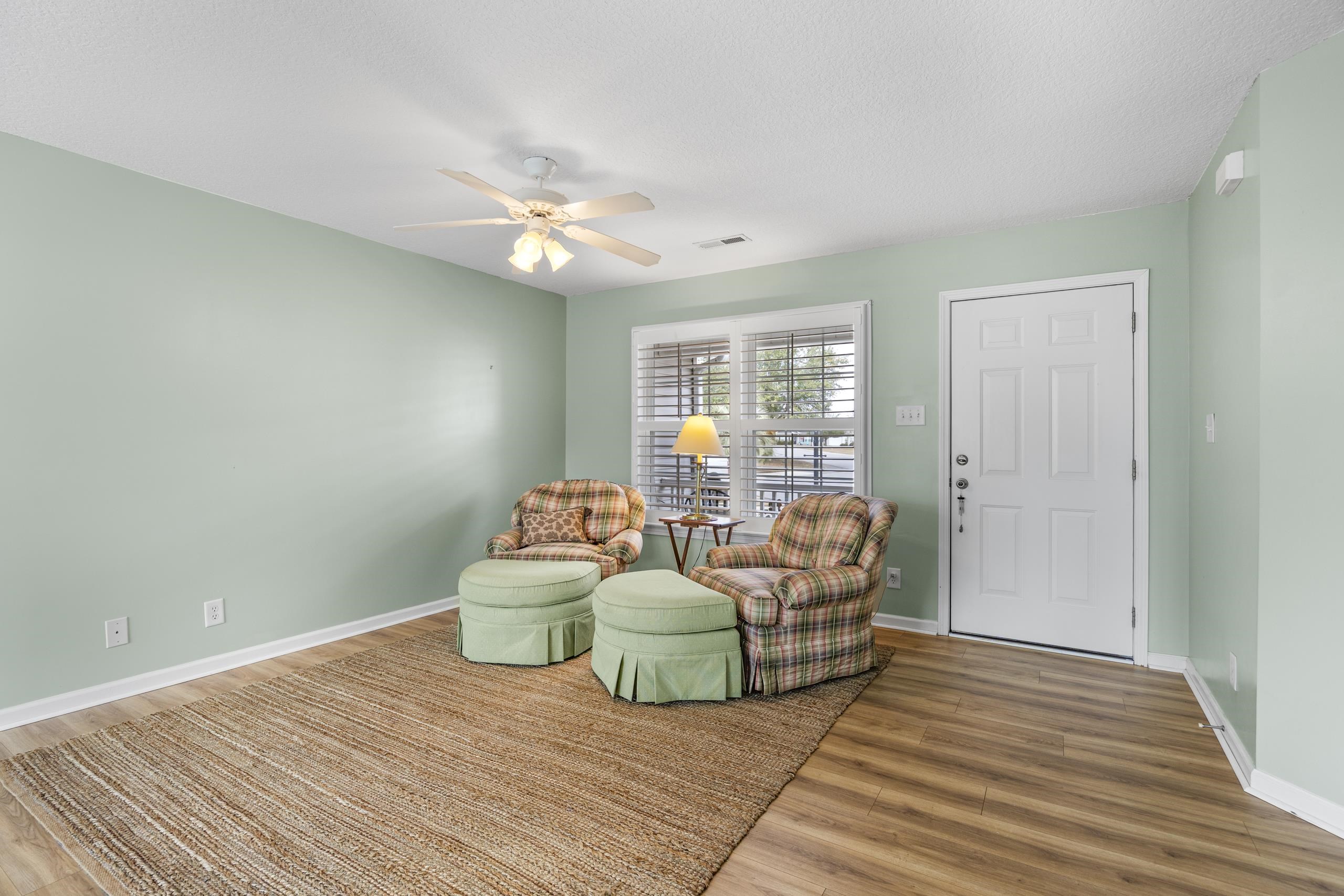 722 Downing Court Longs, SC 29568 - Photo 2 of 40 Living area with wood finished floors, a textured ceiling, and a ceiling fan