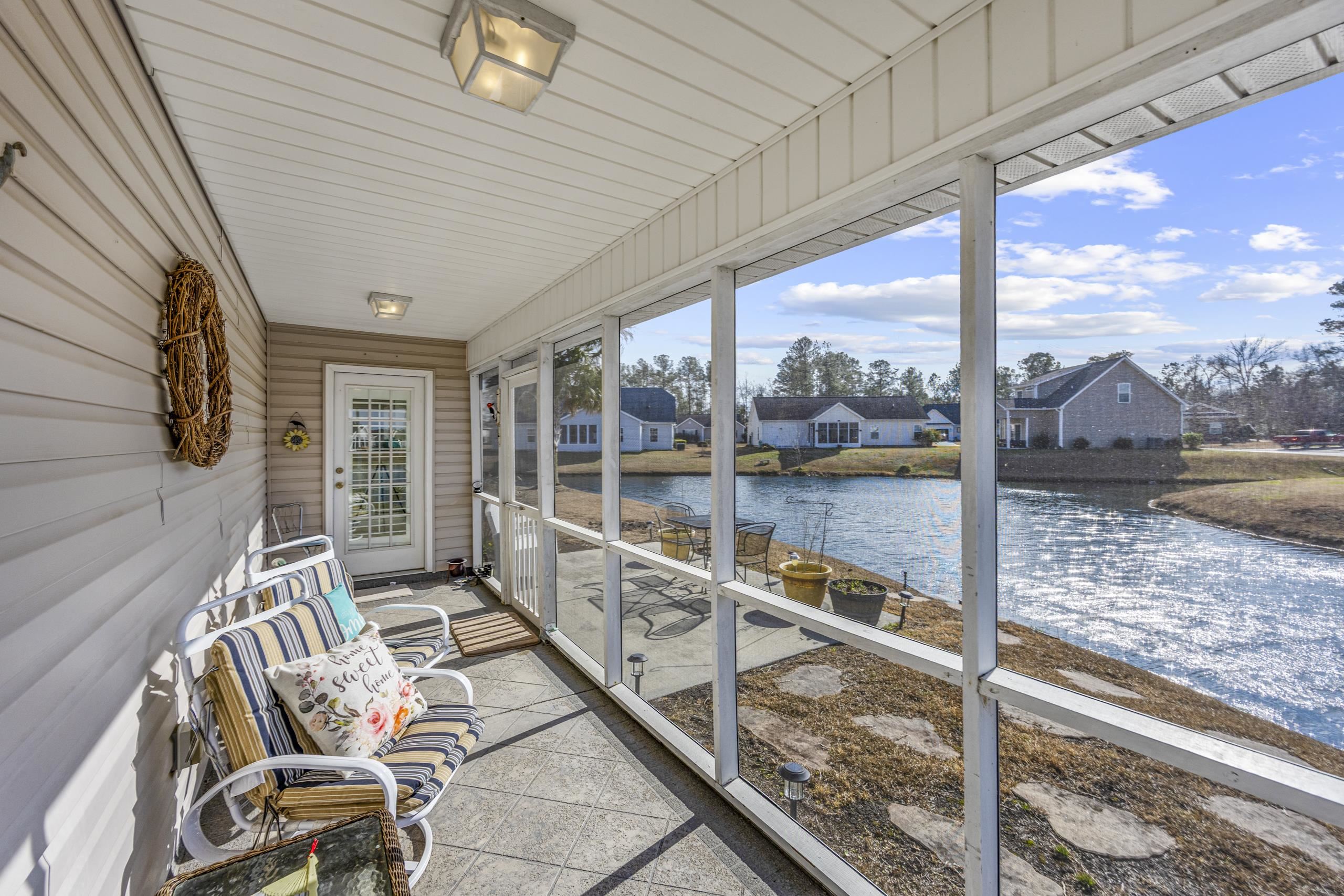 722 Downing Court Longs, SC 29568 - Photo 26 of 40 Screen Porch with a residential view and a water view